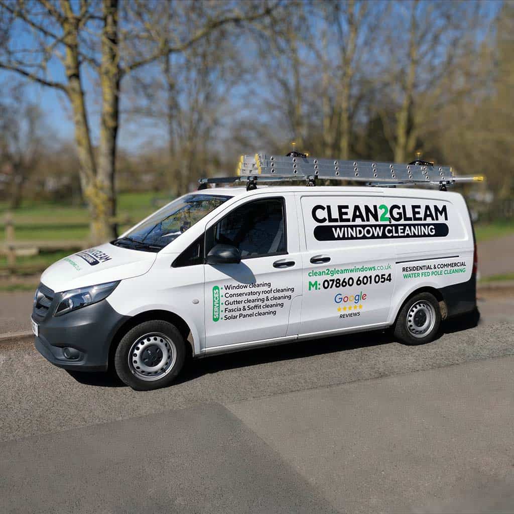 Clean 2 Gleam sign written window cleaners van
